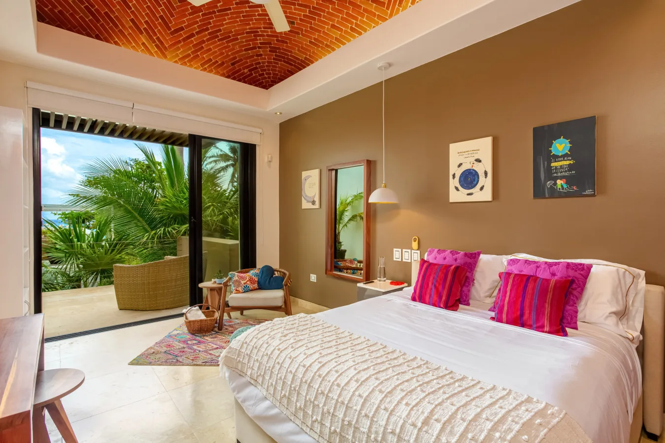 A suite at Casa de las Estrellas with a wood headboard and garden view